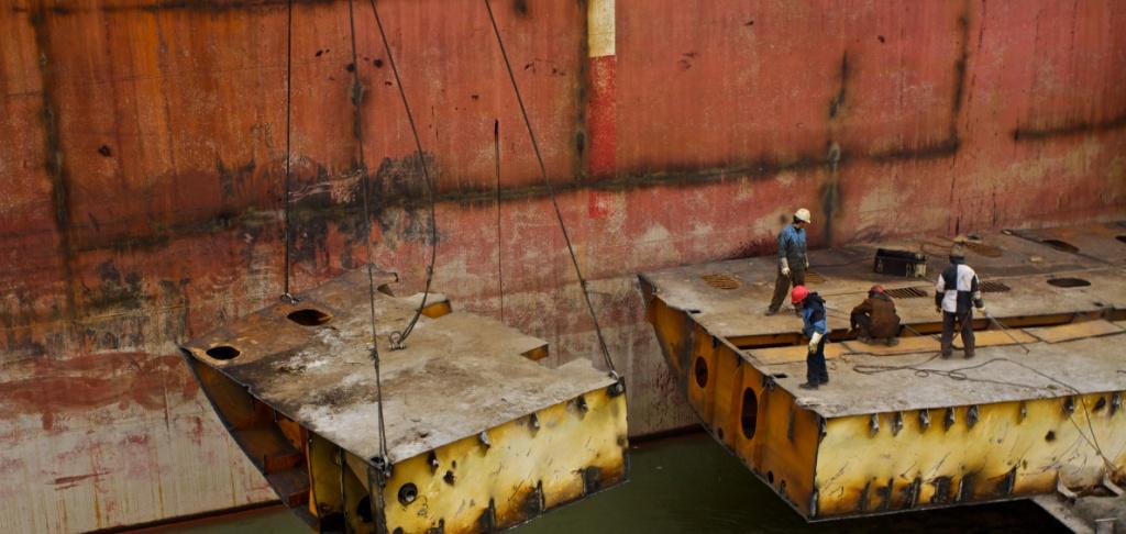 The final stages of recycling, Double bottom sections are removed while the next ship is already waiting alongside